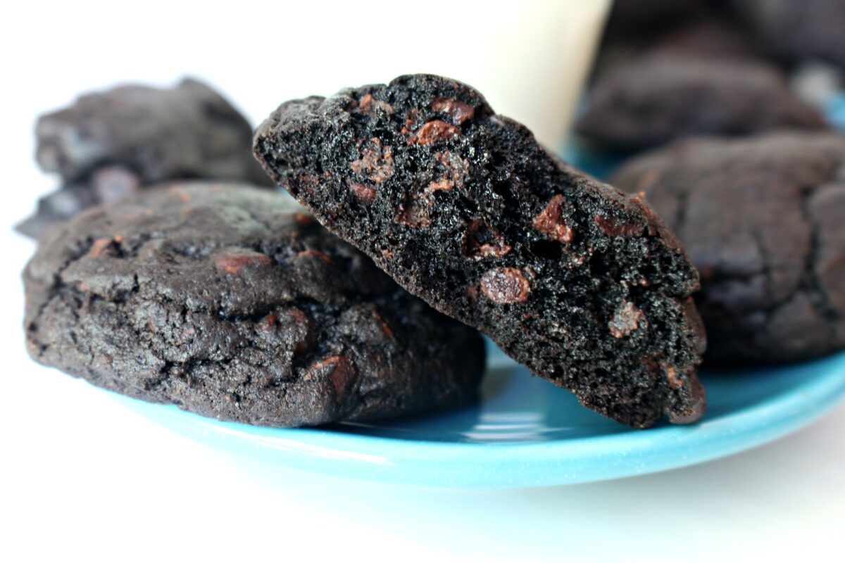 Closeup showing the very dark, moist interior of a brownie cookie.