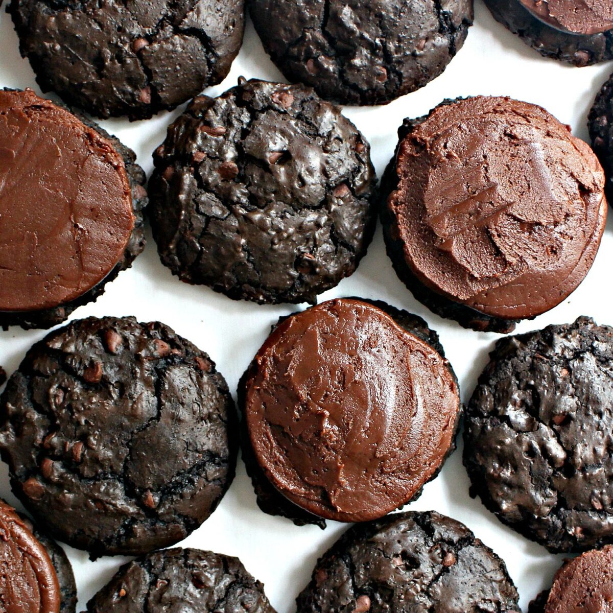 Fudge Brownie Cookies with some topped with chocolate frosting.