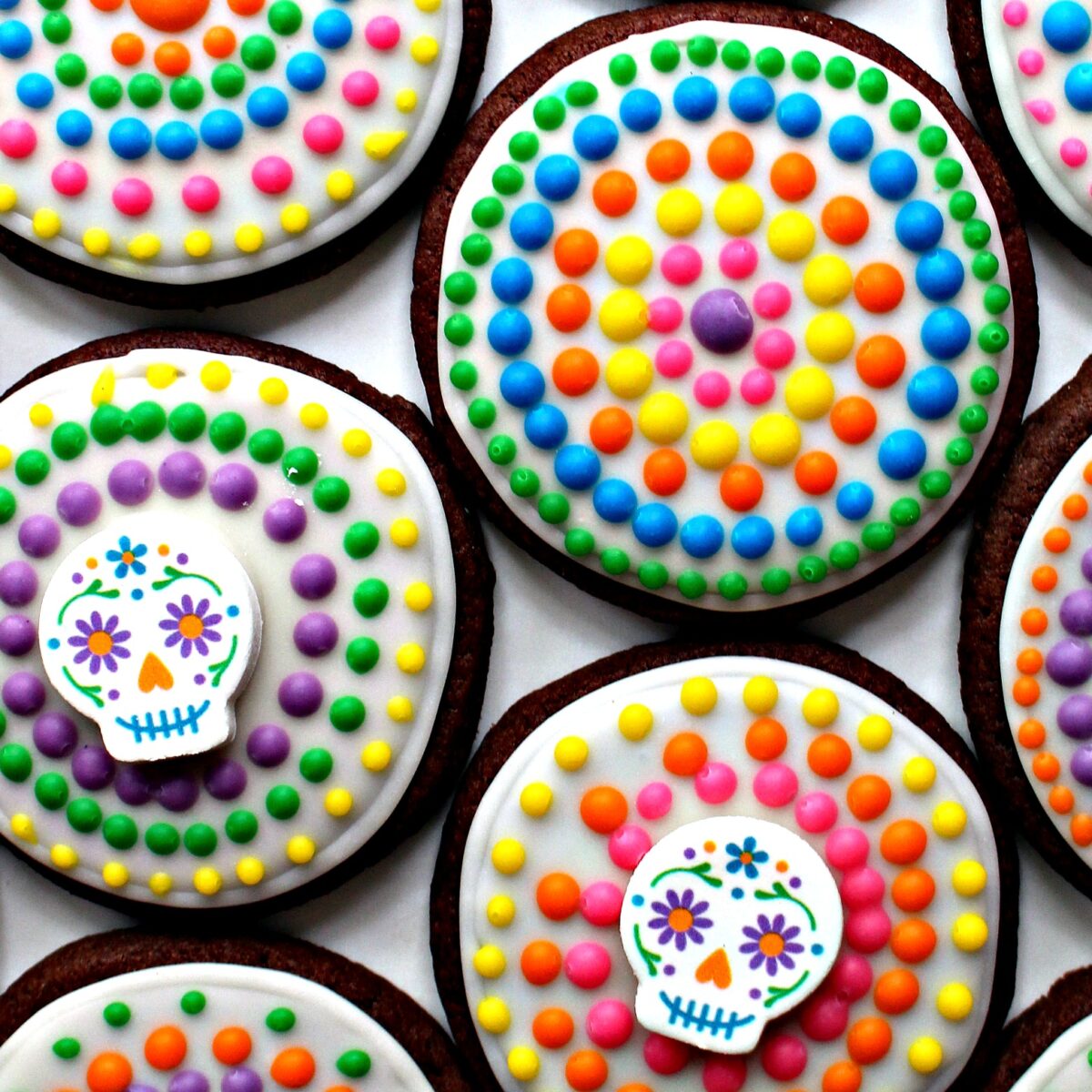 Day of the Dead cookies closeup showing circles of colorful dot decorations.