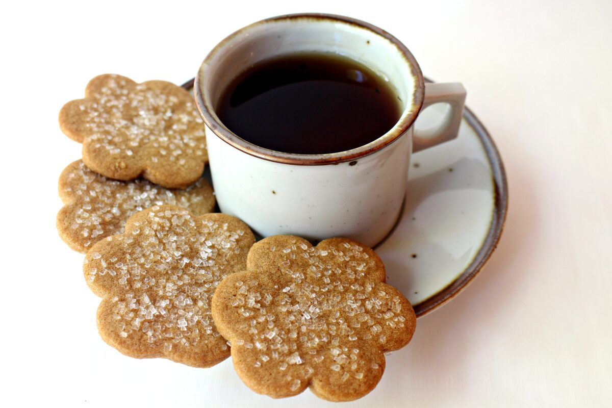 Cinnamon Cookies on a saucer with a cup of tea.