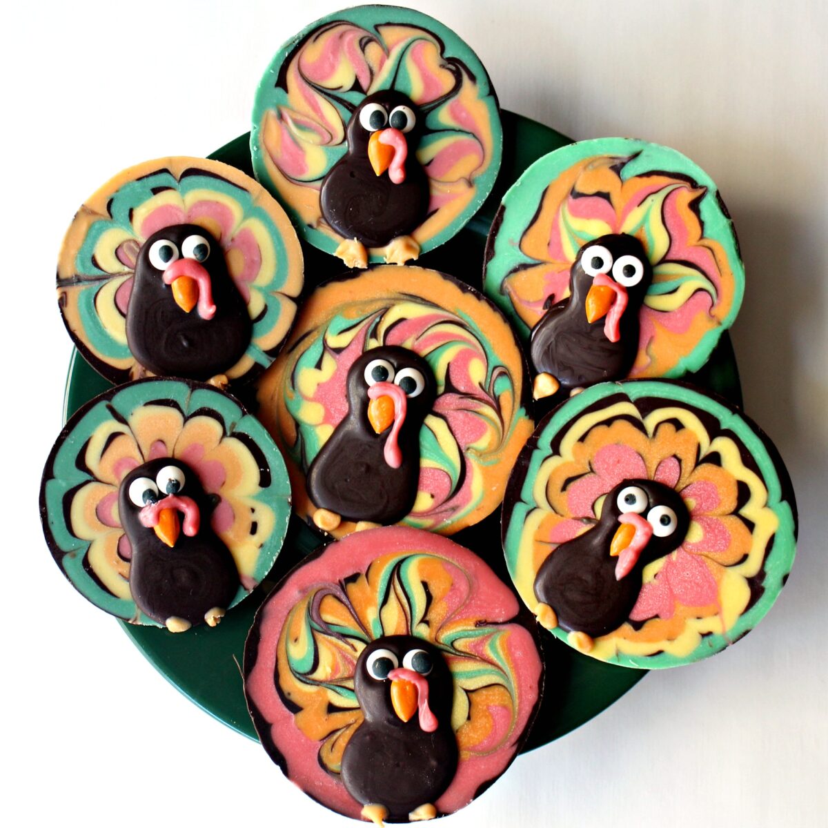 Colorful Chocolate Bark Turkey discs on a serving platter.