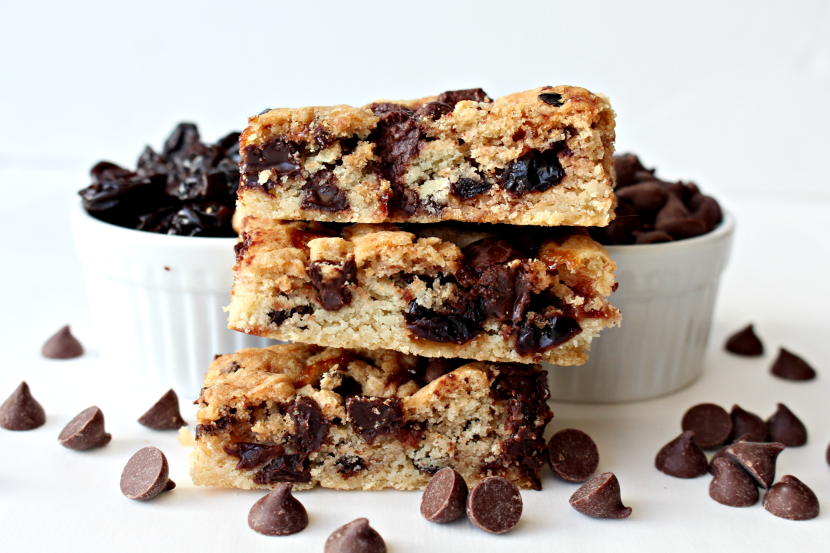 Closeup of stacked bars showing cherries and chocolate chips inside.