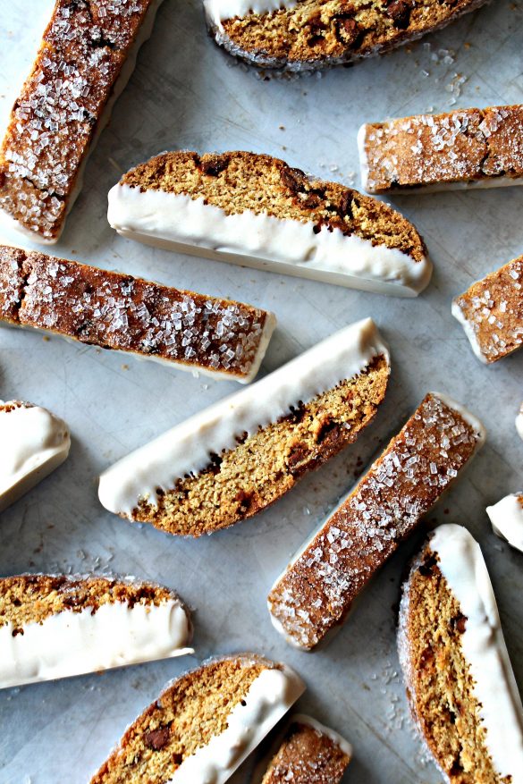 Cinnamon Chip Biscotti (Time Saver Recipe) with sparkling sugar on top and dipped in cinnamon white chocolate on the bottom.