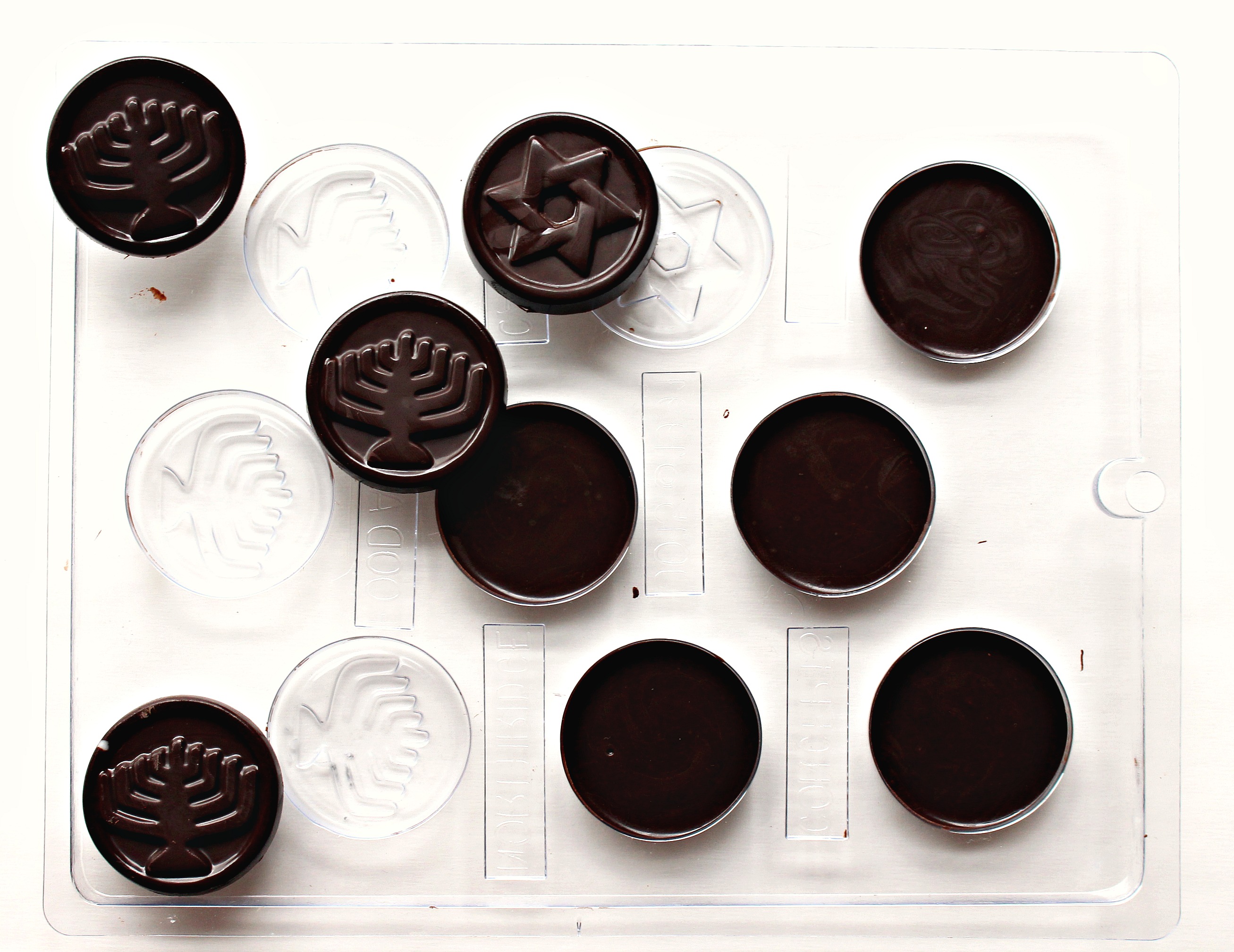 Chocolate discs in a plastic mold