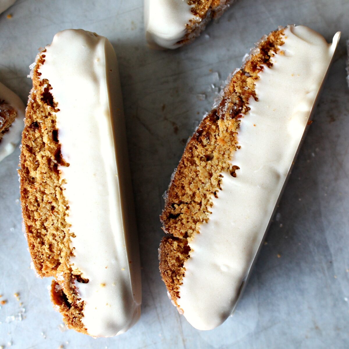 Cinnamon Chip Biscotti  with bottom dipped in white chocolate.