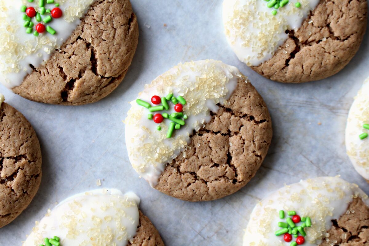 Closeup of the top of a Gingerbread Spice Cookie half dipped in white chocolate.