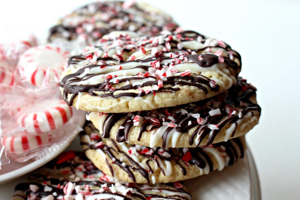 Peppermint Crunch Cookies stacked to show thin cookie edge
