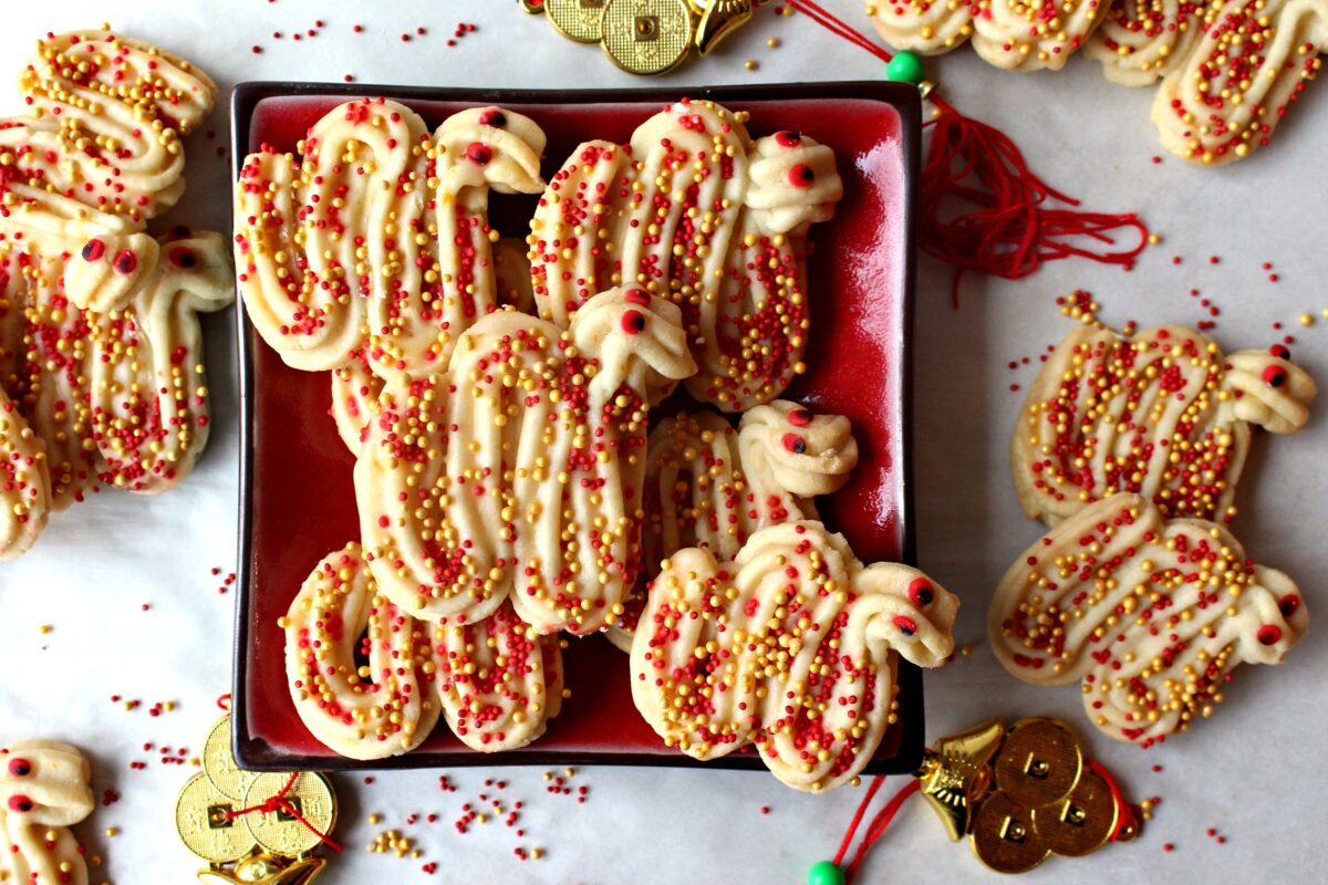 Dragon cookies on a red plate.