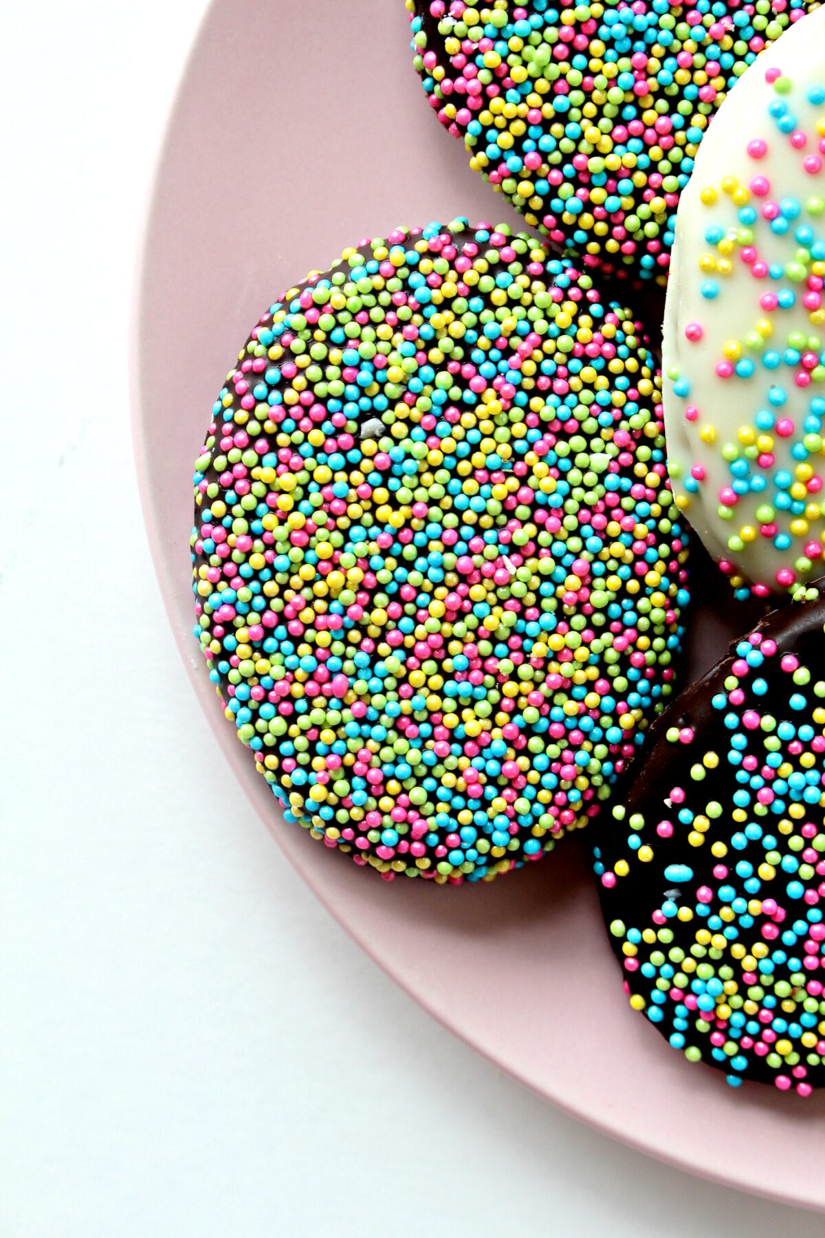 Closeup of Chocolate Covered Graham Cracker Easter Egg covered in pastel nonpareils.