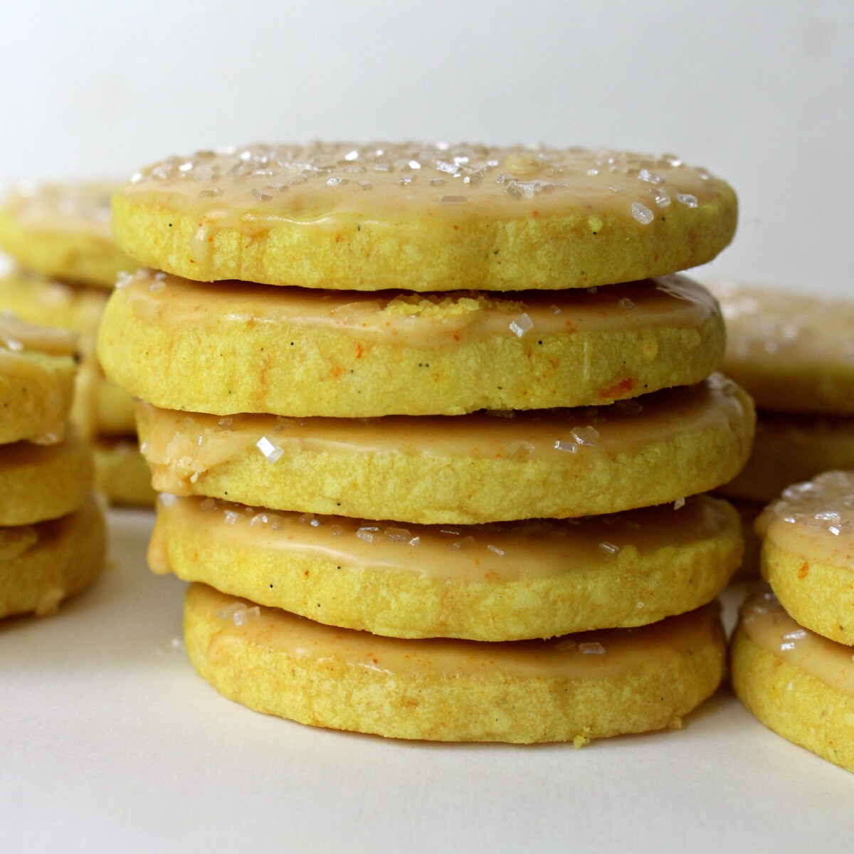 A stack of iced cookies shown from the side.