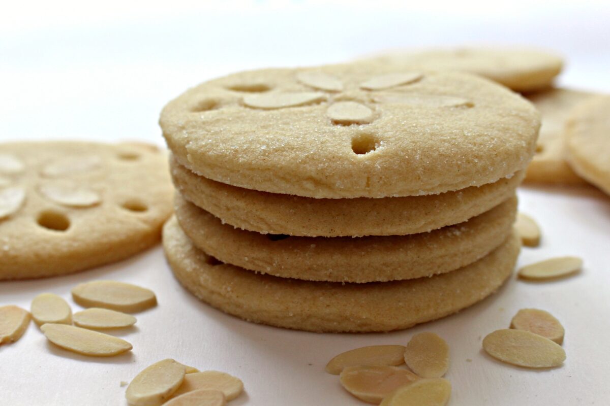 Stack of almond cookies showing thin round edges.