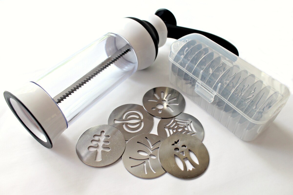 Oxo cookie press with discs and disc case.