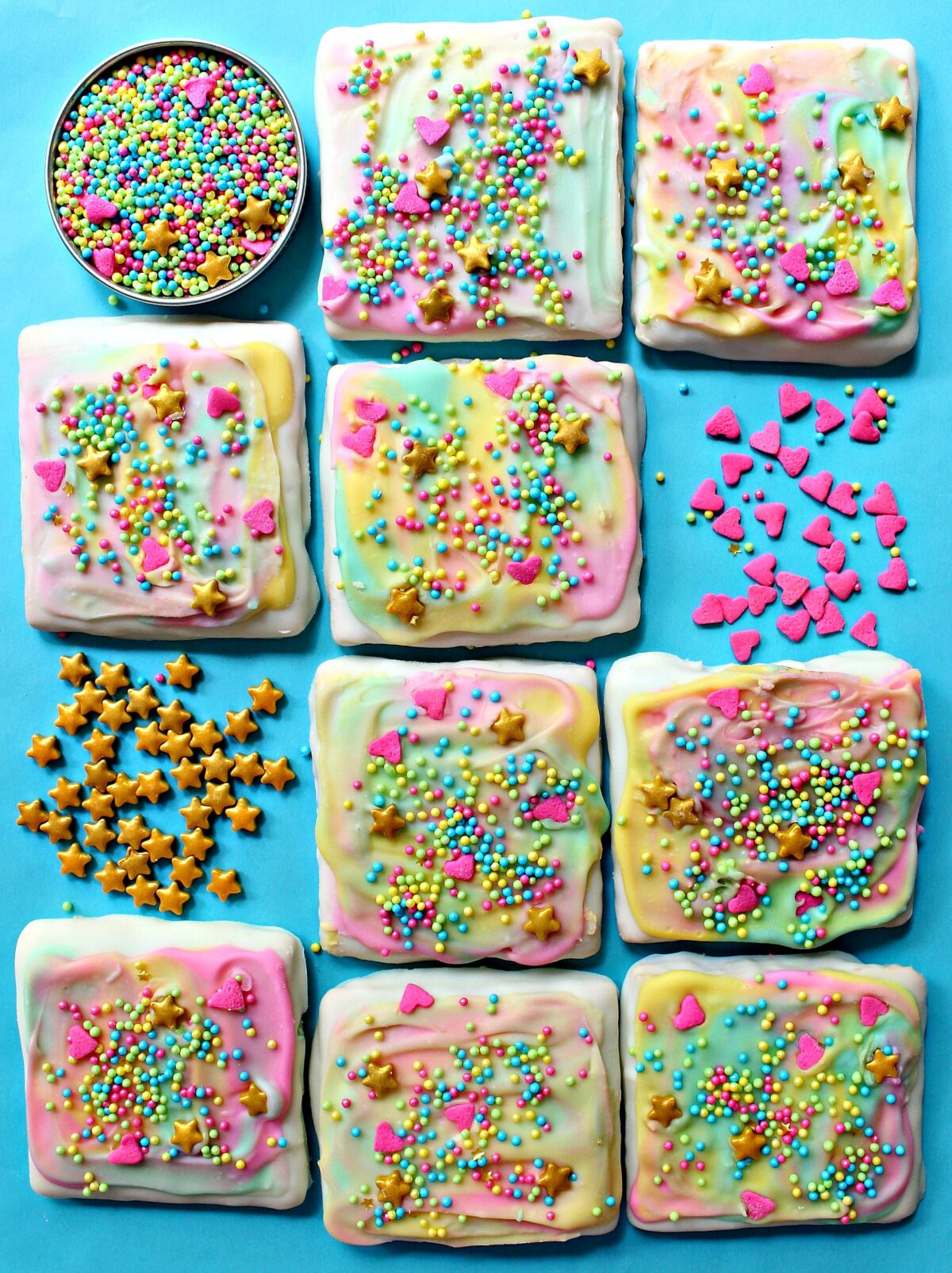 Unicorn Graham Crackers are square grahams topped with colorful white chocolate swirls and sprinkles.