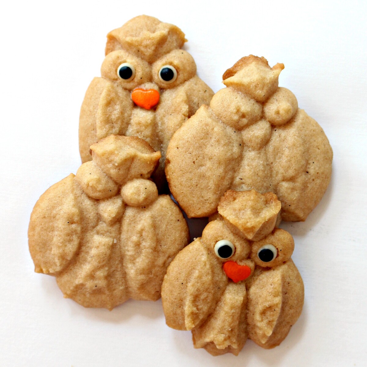 Cinnamon Spritz Owl Cookies plain and with candy eyes and sprinkle beak.