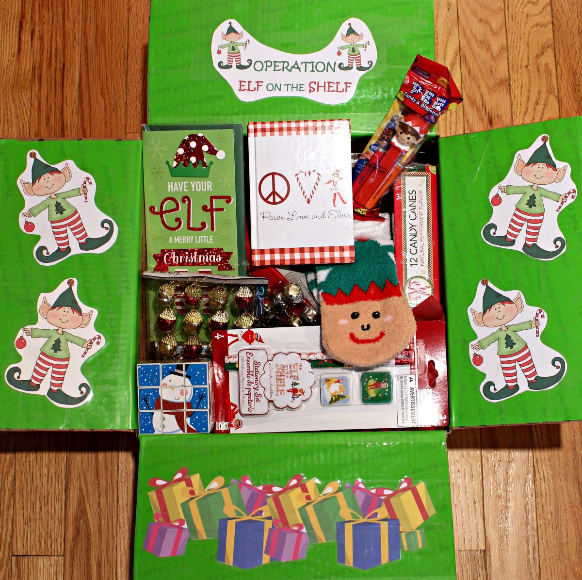Filled Elf on the Shelf Christmas Care Package with decorated flaps.
