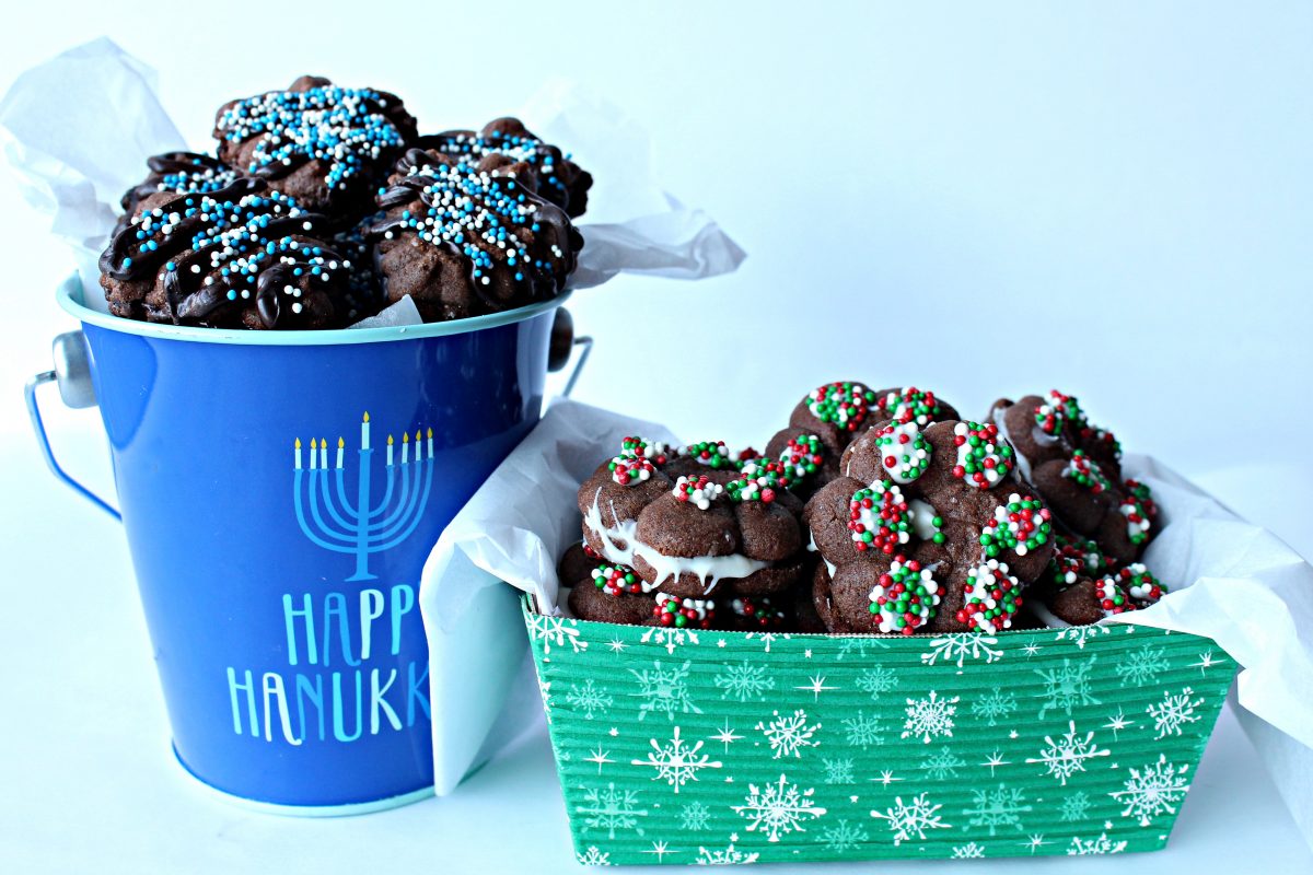 Chocolate Espresso Spritz Cookies in a blue Hanukkah bucket and a green Christmas container for gifting.