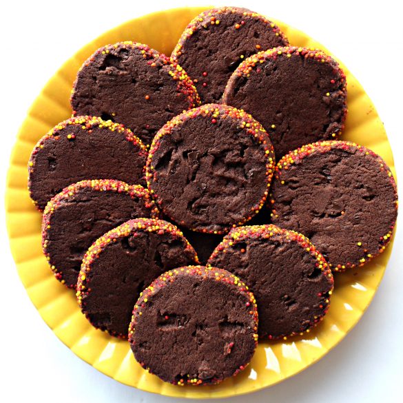 sliced Spiced Chocolate Shortbread Cookies on a bright yellow plate.