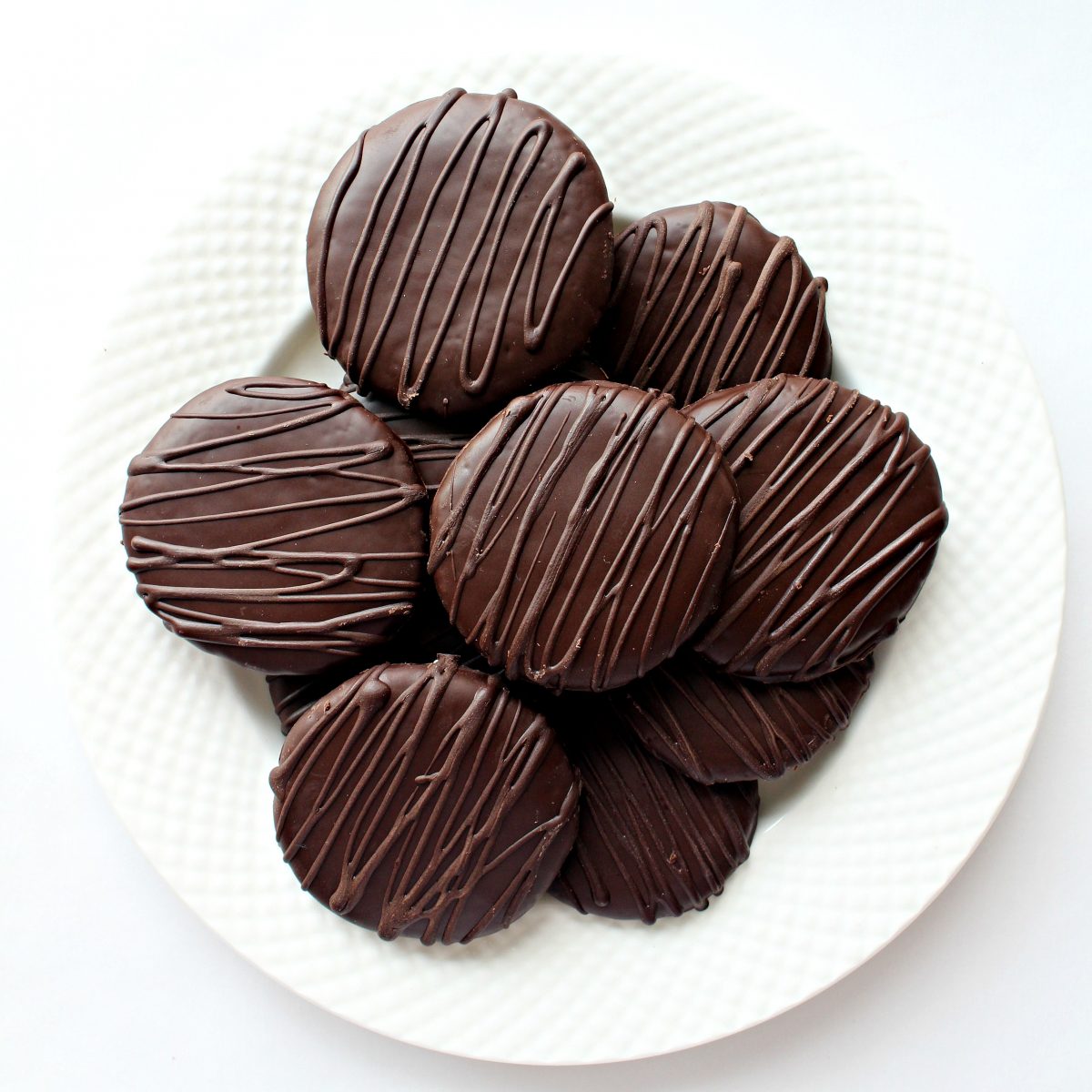 Chocolate covered cookies on a plate.