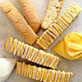 Lemon Biscotti with white and yellow striped icing.