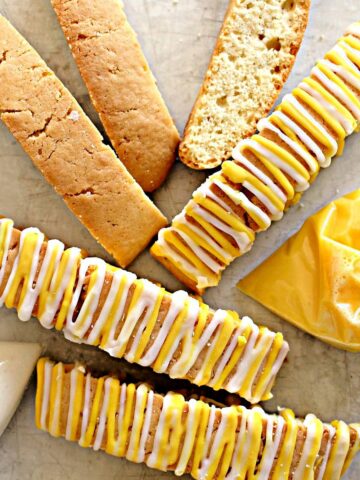 Lemon Biscotti with white and yellow striped icing.