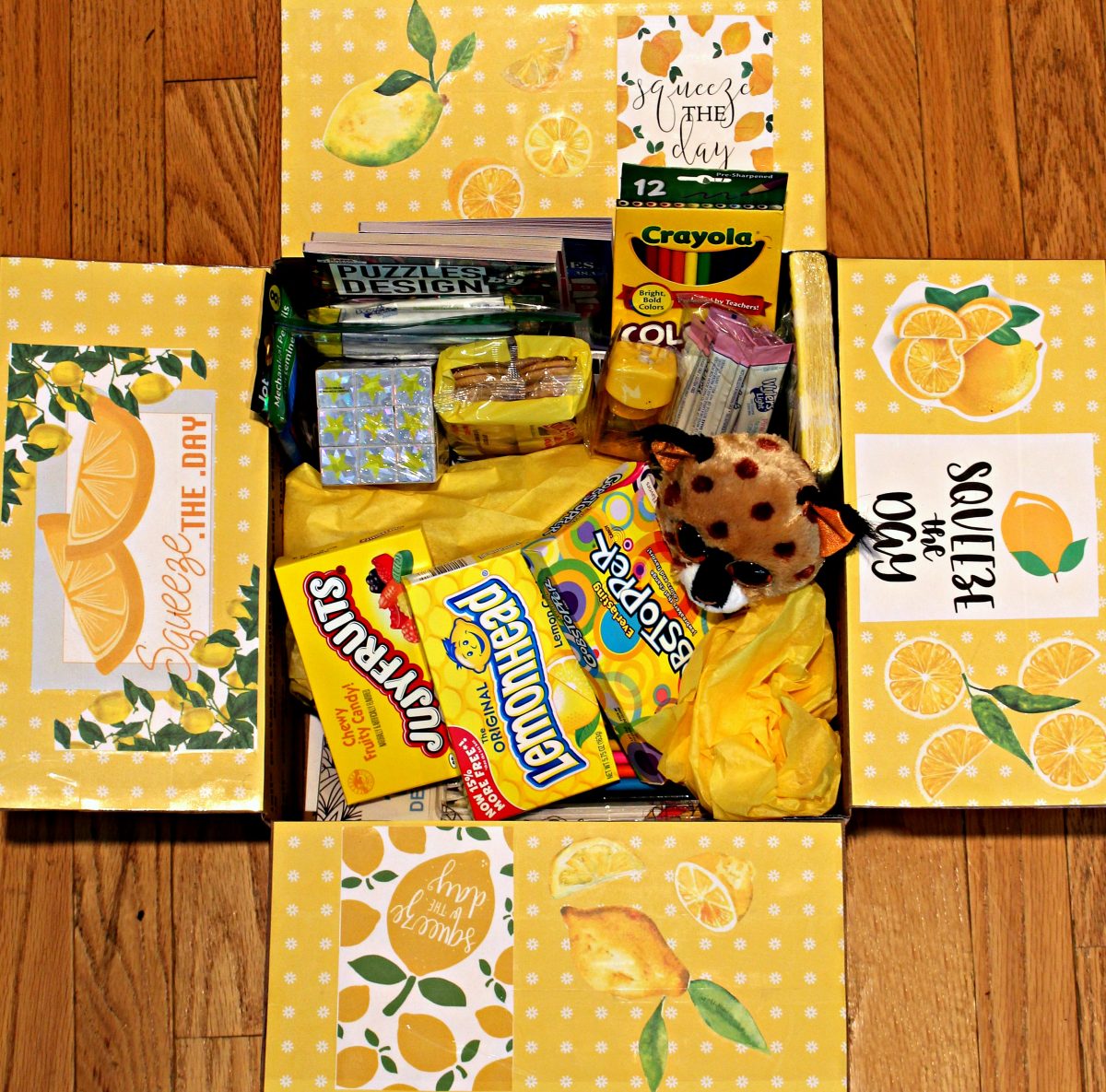 Care package with flaps decorated with yellow and white polka dots,lemons, and "squeeze the day" .