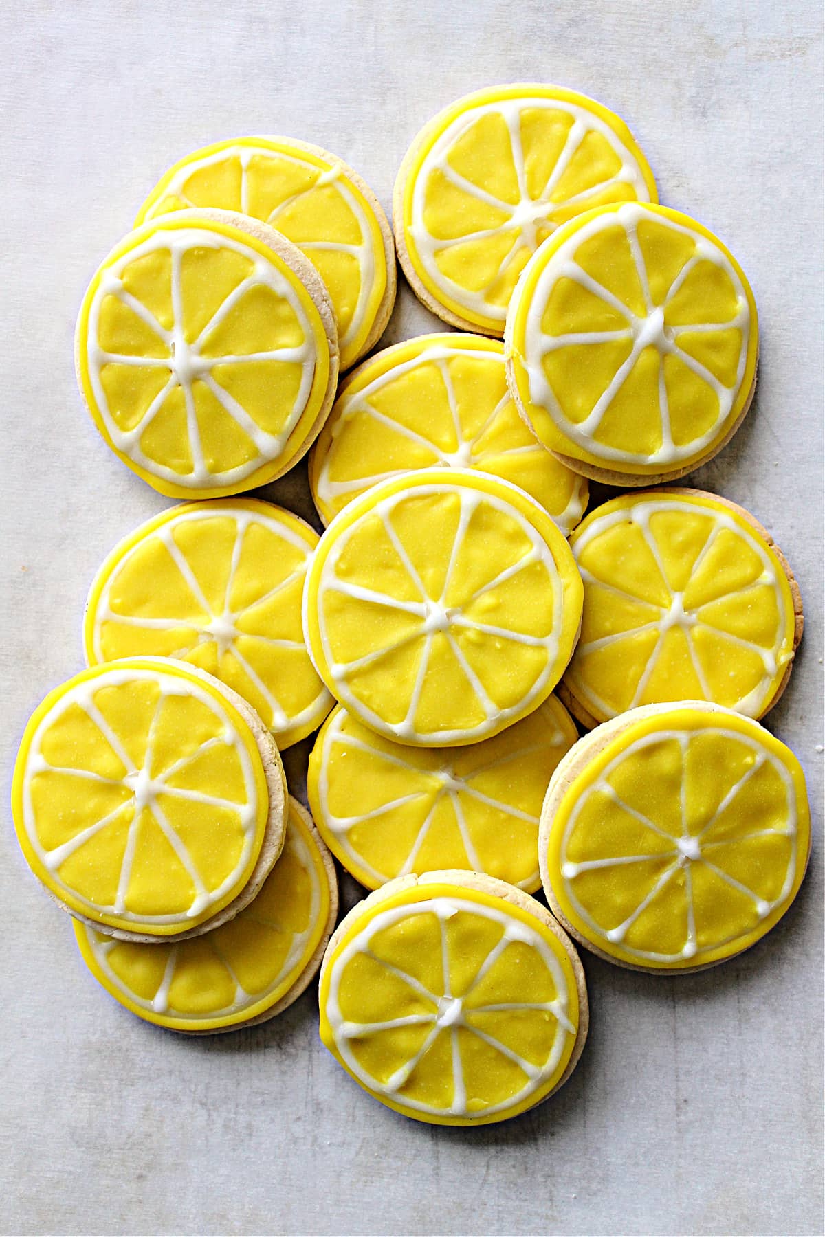 Round cutout sugar cookies iced like segmented lemon slices.