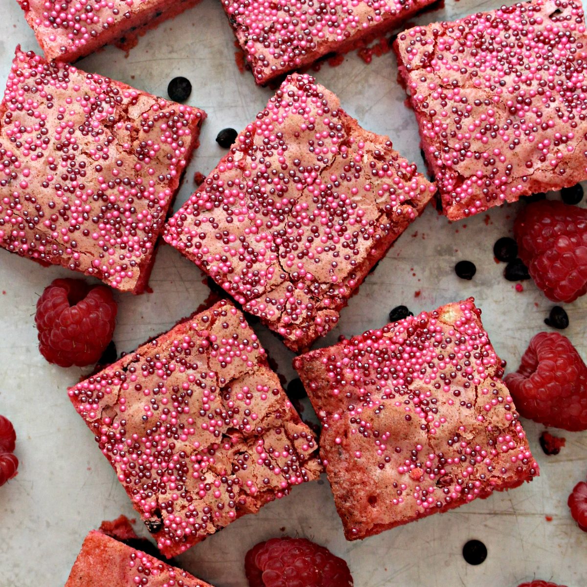 Closeup of Raspberry Chocolate Chip Bars with red and pink nonpareil sprinkles on top.