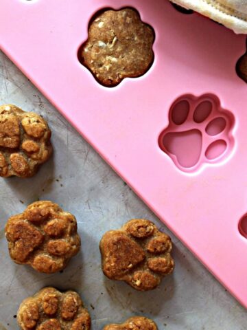 Pawprint shaped dog cookies with a silicone mold.