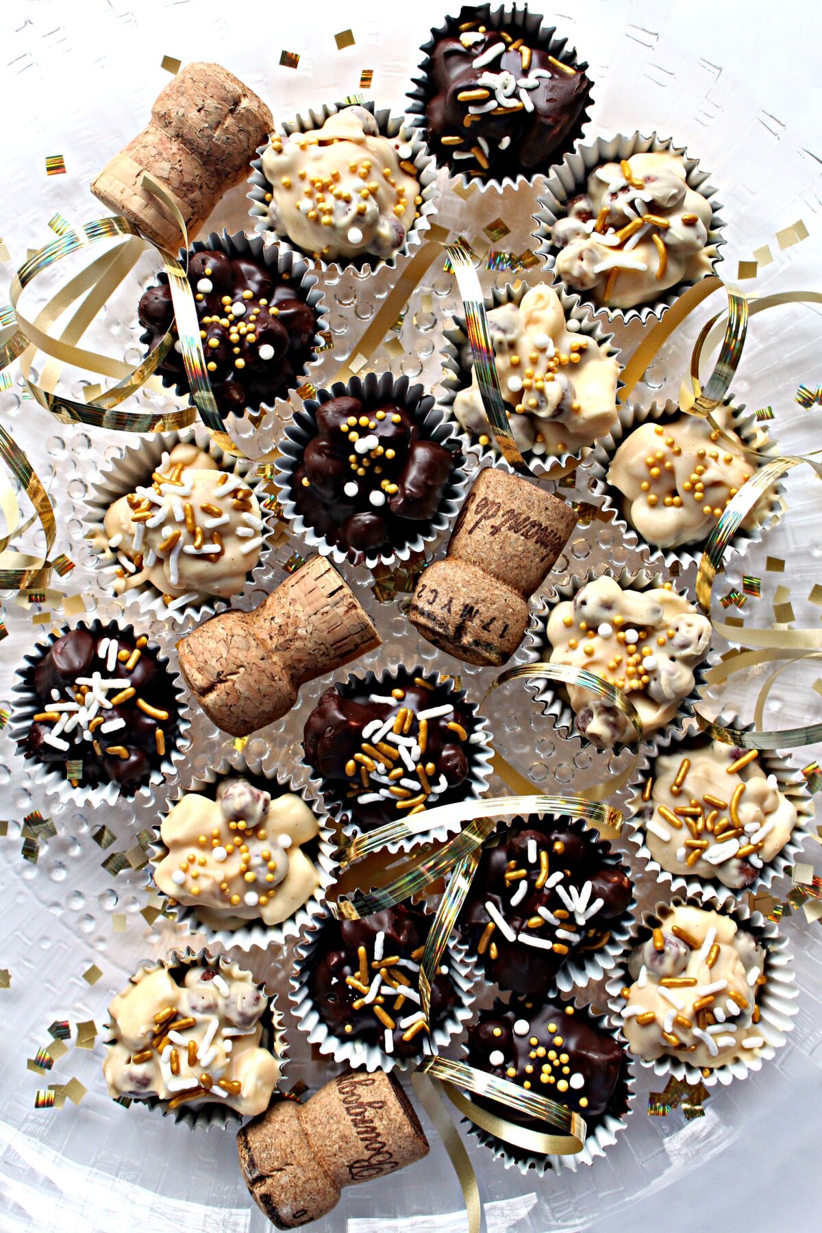 No Bake Chocolate Peanut Butter Cookies, champaign corks and gold ribbon on a white surface..