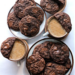 Chocolate Chip Mocha Cookies on plates with two cups of coffee