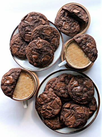 Chocolate Chip Mocha Cookies on plates with two cups of coffee