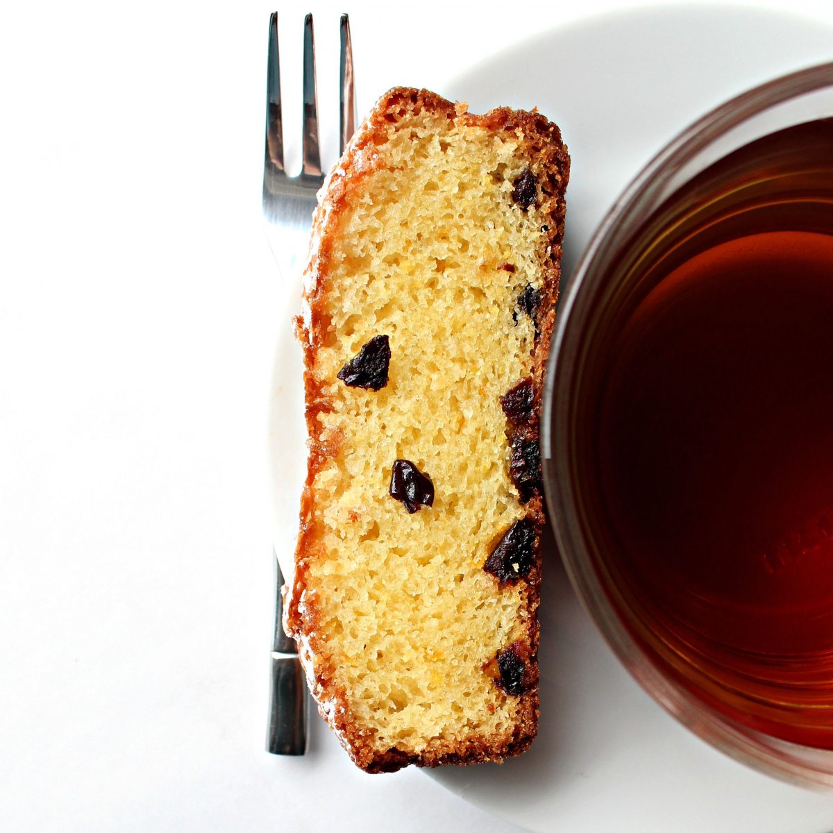 Slice of Orange Olive Oil Cake with a cup of tea.