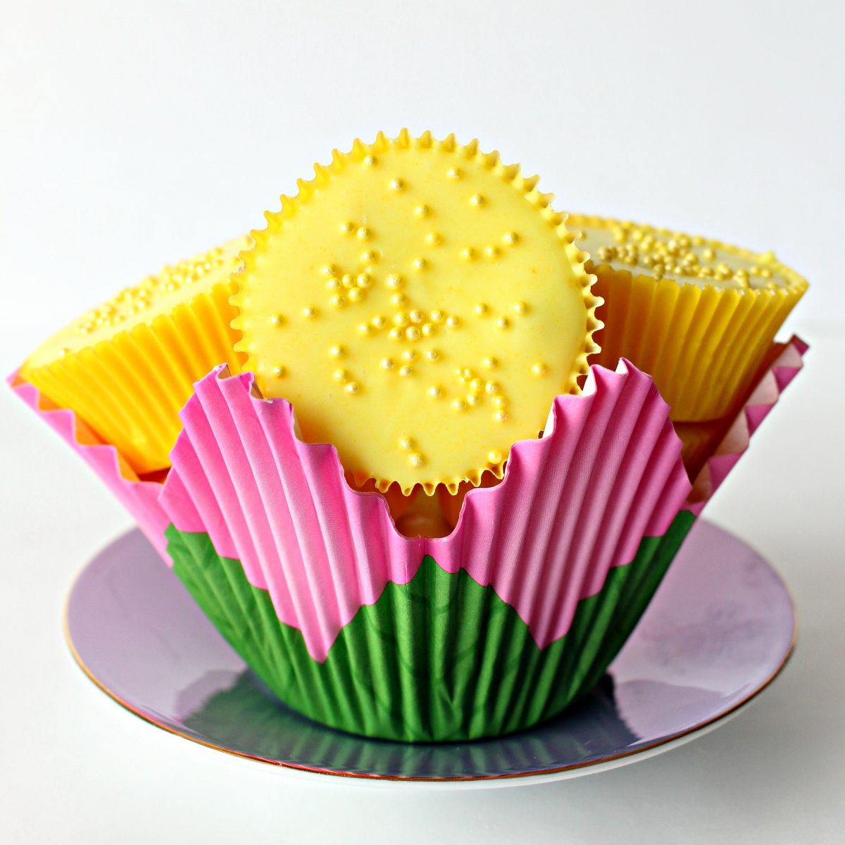 Yellow peanut butter cups in a cupcake paper shaped like a flower.