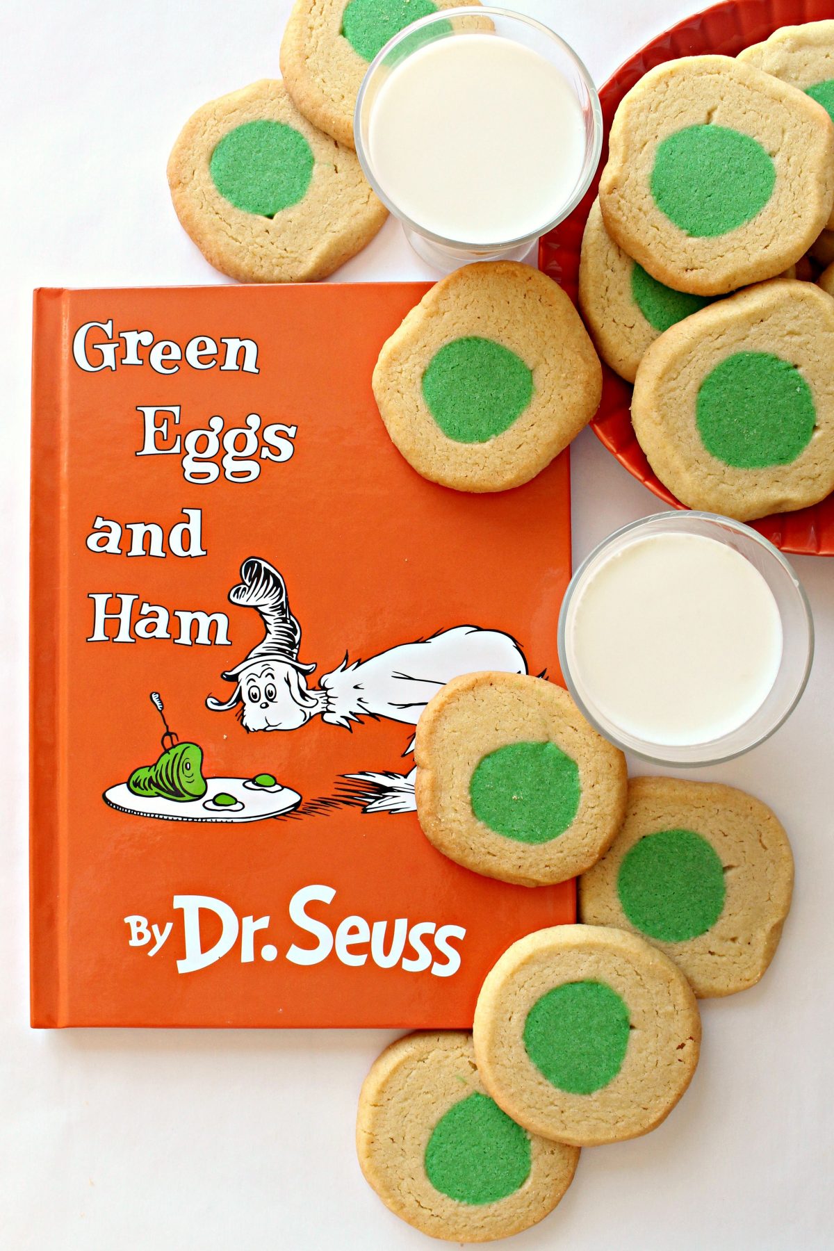 Green Eggs and Ham book with cookies with green circle centers and milk.