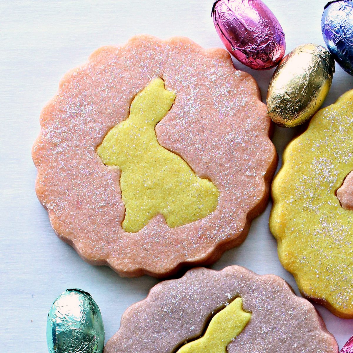 Pink cookie with yellow bunny center sparkling with edible glitter.