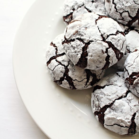 Chocolate Crinkle Cookies with chocolate cracks in the powdered sugar coating.