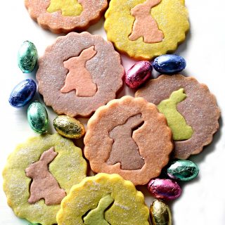 Pastel colored shortbread cookies with rabbit silhouette cutout centers