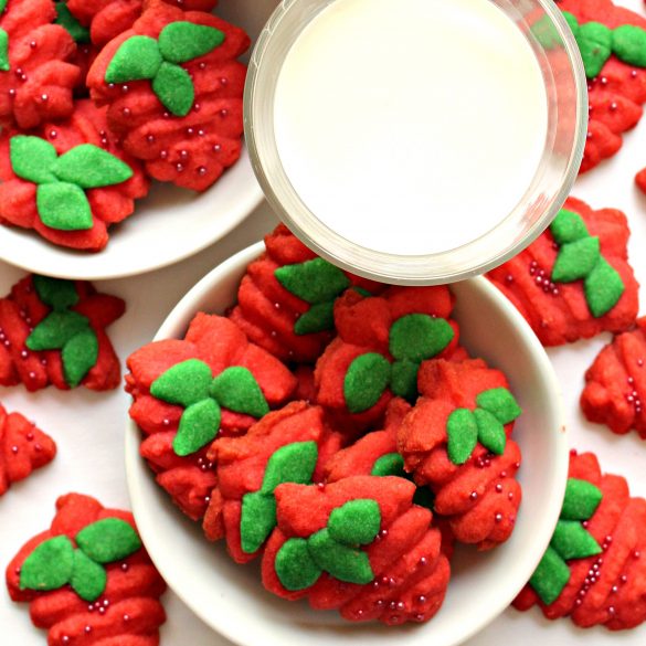  Red Strawberry Press Cookies in white bowl with glass of milk