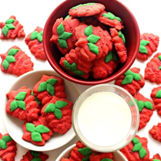 Strawberry shaped spritz cookies in bowls.