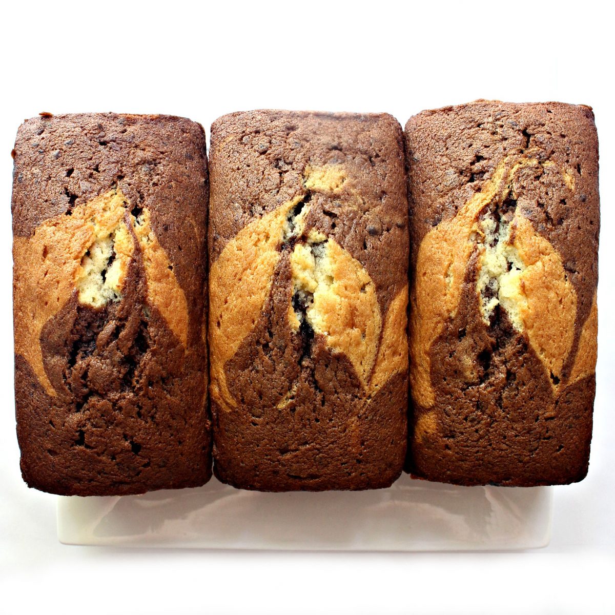 Three loaves of marbled chocolate and vanilla pound cake.
