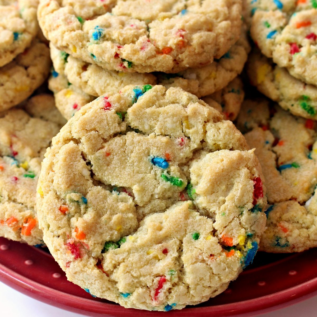 Cookie closeup showing crackled top and bright colored sprinkles.