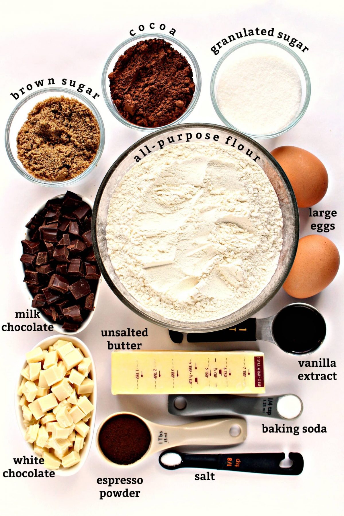 Ingredients with text labels: flour, sugar, white/milk chocolate, eggs, butter, vanilla, salt, espresso powder.