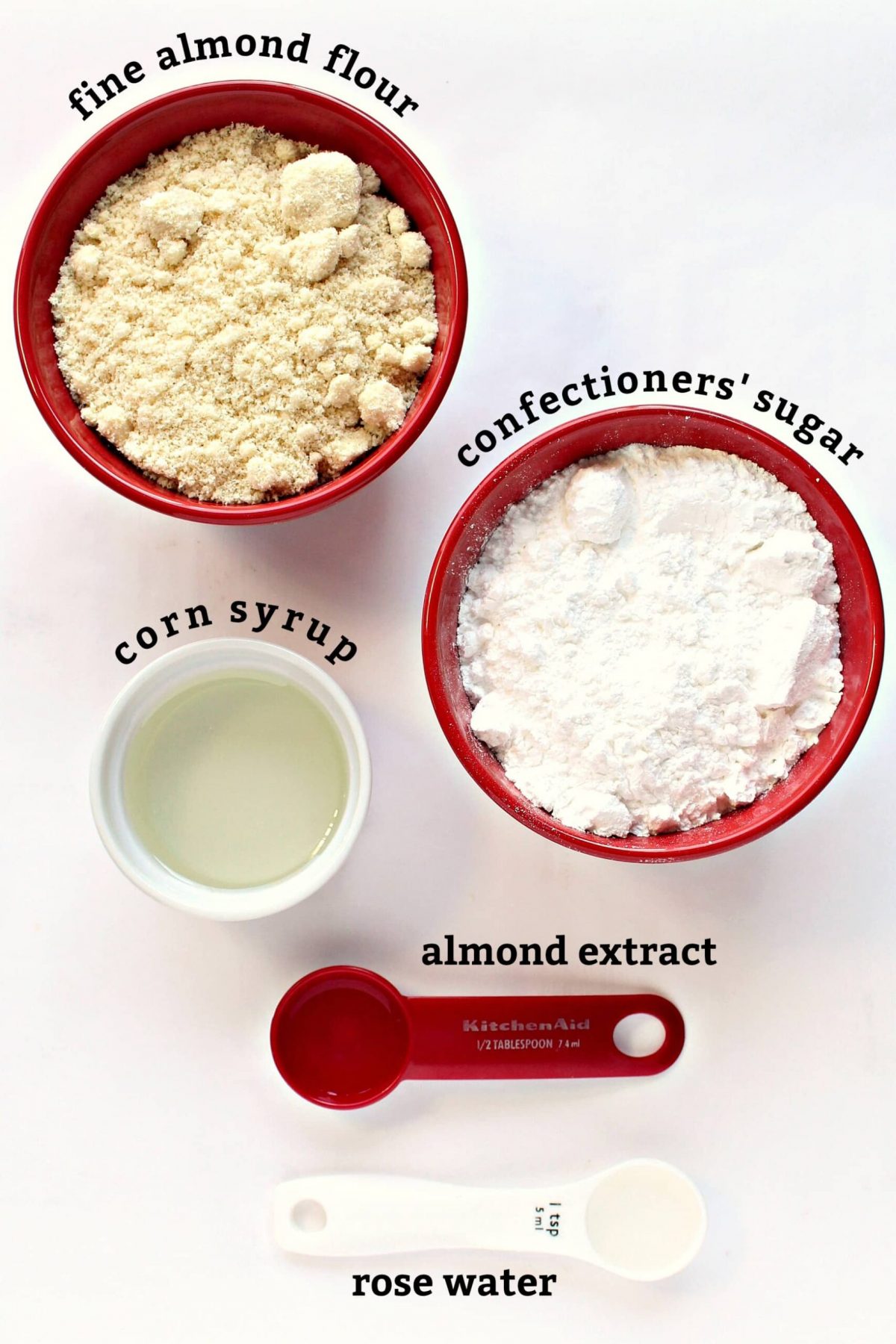 Recipe ingredients with text labels: fine ground almond flour, confectioners' sugar, corn syrup, almond extract.