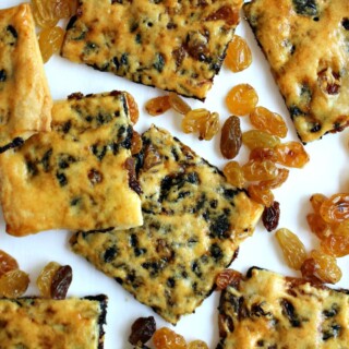 Closeup of raisin biscuit squares with golden crust speckled with raisins.