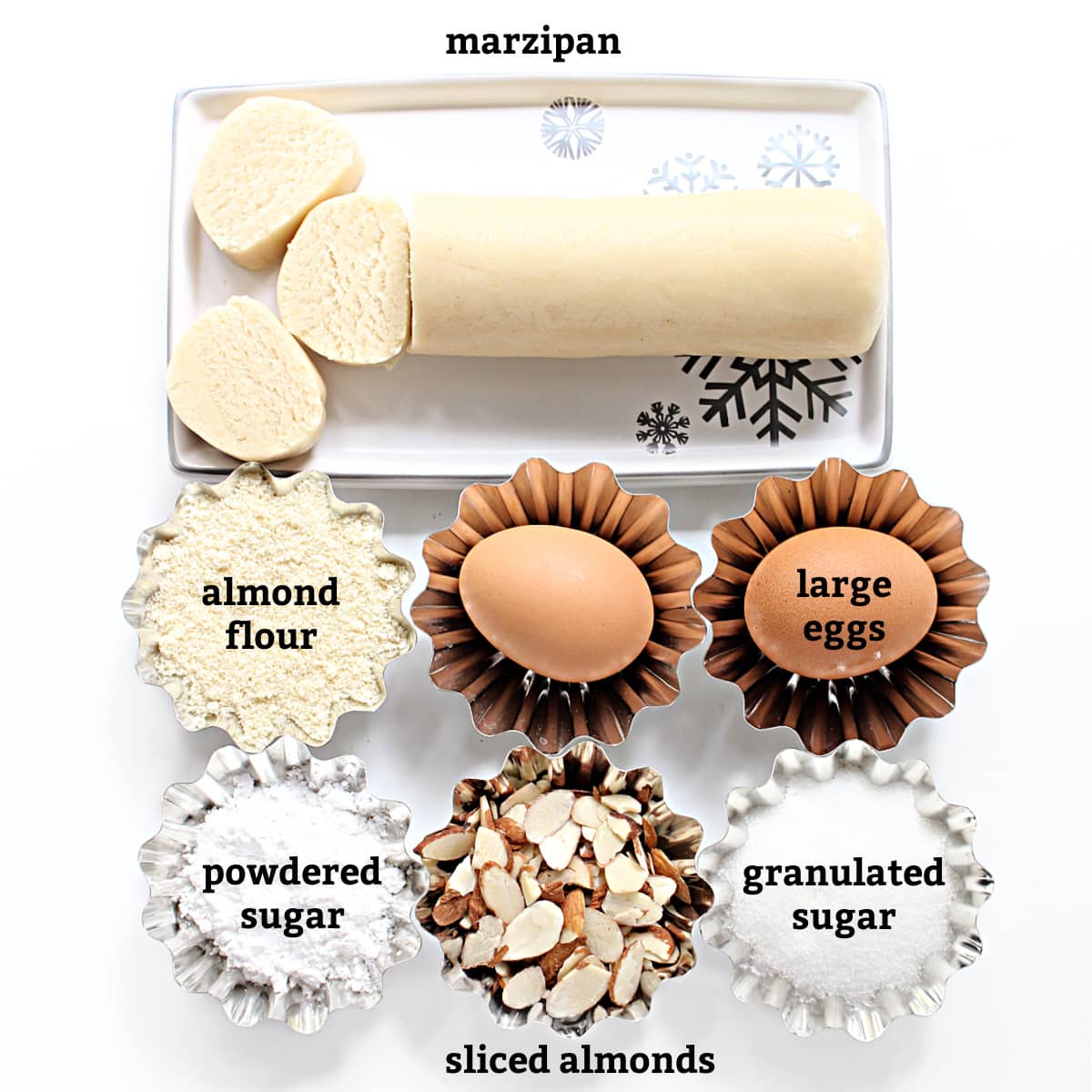 Ingredients labeled; marzipan, almond flour, large eggs, powdered sugar, sliced almonds, granulated sugar.