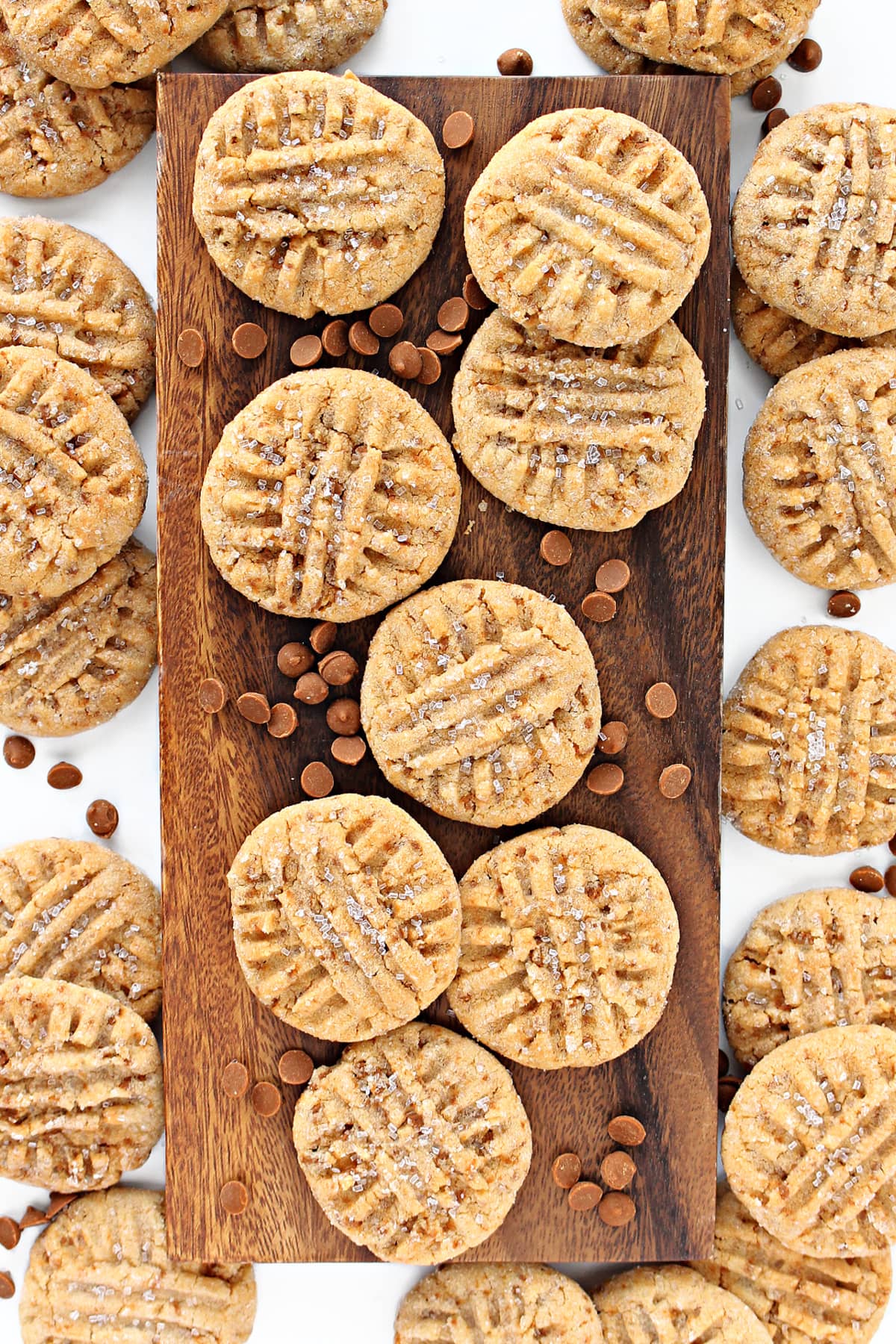 Cinnamon cookies topped with a crisscross pattern and sparkling sugar.