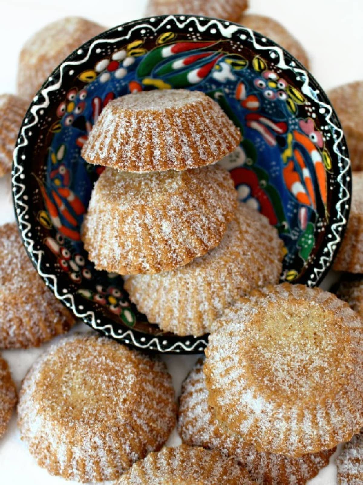 Bosnian Butter Cookies (Šape) in tartlet shapes coated with sugar.