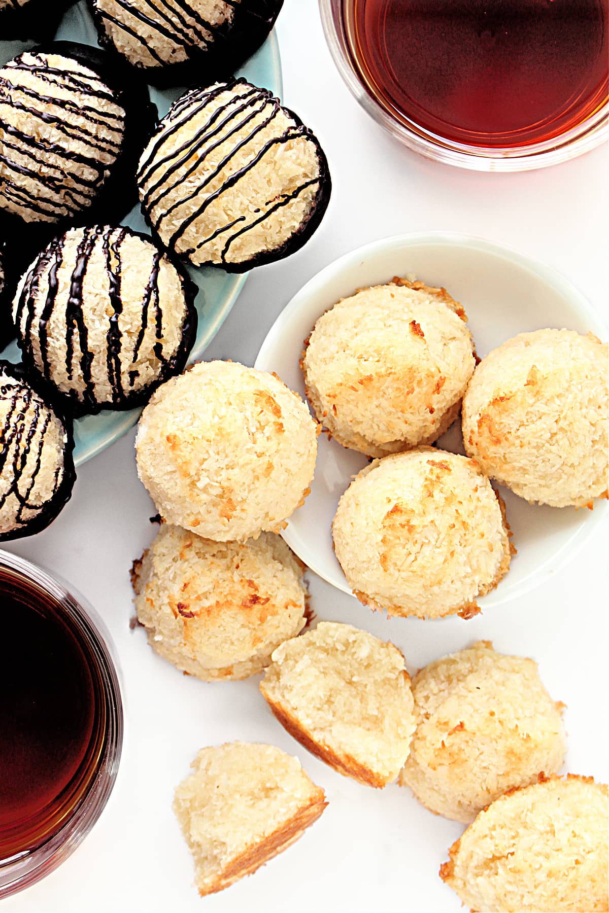 Round coconut macaroons plain and with chocolate drizzle.