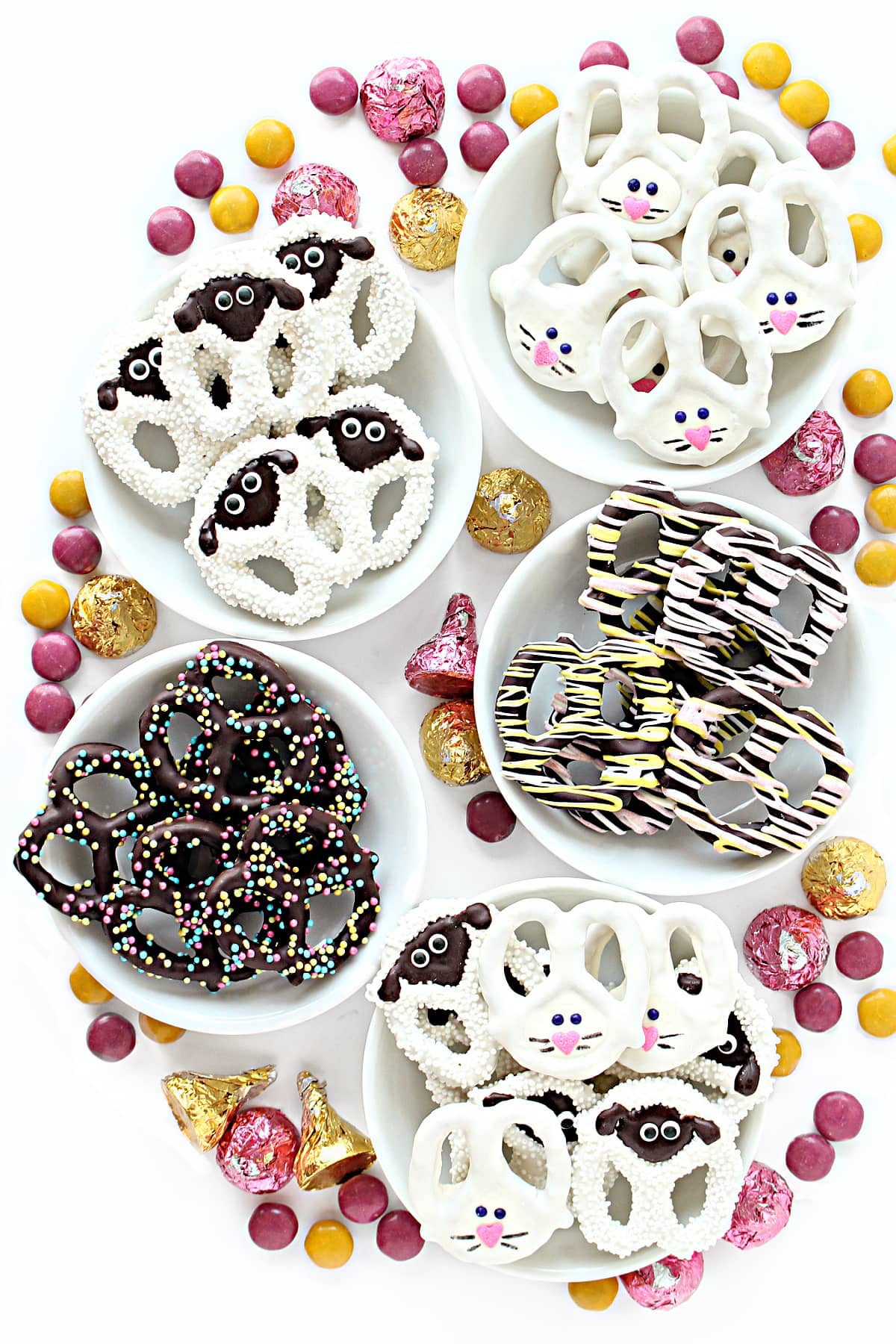 White chocolate dipped pretzel twists decorated like rabbits and sheep.