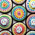 Circle cookies decorated with colorful icing dots.